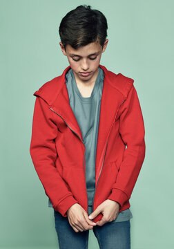 Boy zipping sports jacket