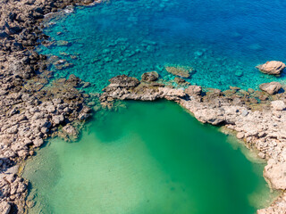 Crete Coast Line from Top during summer time with a round lagoon and crystal water