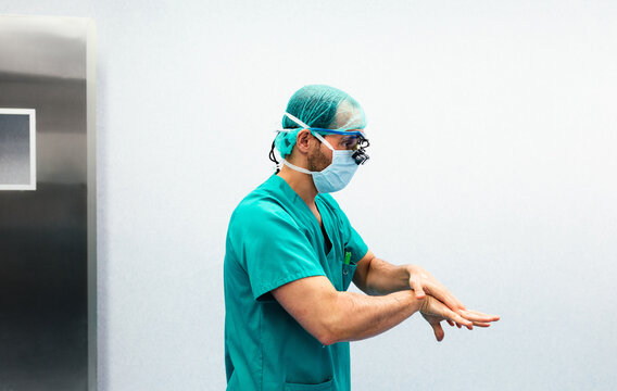 Doctor washing hands before a surgical intervention