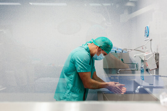 Doctor washing hands before a surgical intervention