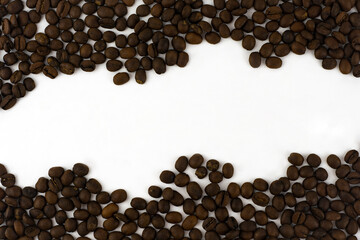 Abstract coffee beans background with white copy paste in the center.