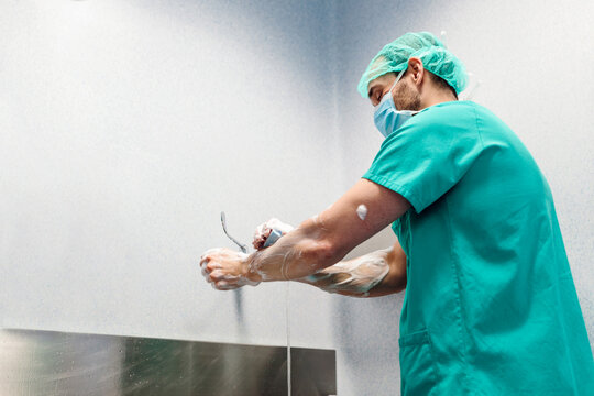 Doctor washing hands before a surgical intervention