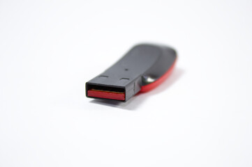 Flash drive with black and red colors and white background