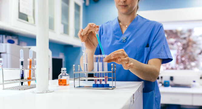 Young Biologist working with fluids in the laboratory