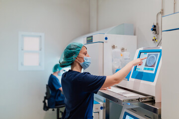 Biologist working with a IVF software in the laboratory