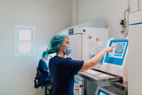 Biologist working with a IVF software in the laboratory