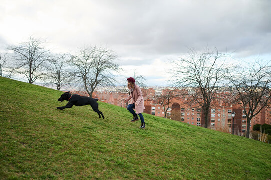Girl and dog running