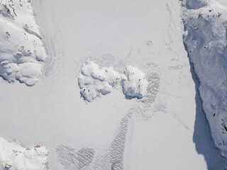 Frozen ice in rough snowy terrain