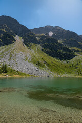 Naklejka na ściany i meble Morgex (Aosta), the wonderful Lake of Arpy, a mirror of water of glacial origin set in a beautiful alpine setting.