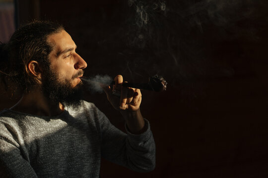 guy smoking a pipe