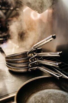 Stacked pans in a restaurant's kicthen