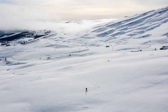 Aerial view of a single man doing backcountry skiing