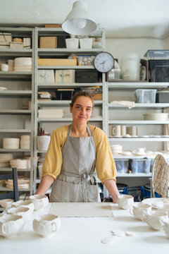 Portrait of a ceramic mater in his workshop