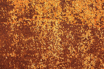 Weathered and rusty metal background. Old iron wall. Worn metal panel. Rusted metal texture