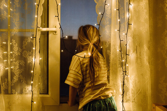 Girl looks out of window