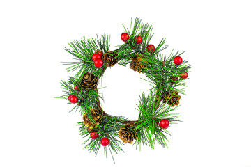 The symbol of Christmas and New Year, a wreath of spruce branches decorated with small red balls, isolate on white.