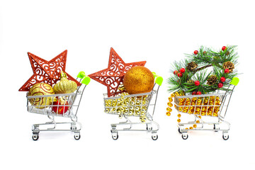 Festive decorations for Christmas and New Year in hypermarket trolleys, are made on white, sales...