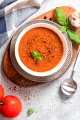 Gazpacho - Spanish cold tomato soup. Top view. Mediterranean cuisine, vegetarian and vegan food. Real homemade gazpacho made from tomatoes, peppers and cucumbers. 