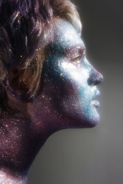 profile portrait of a girl with radiant space make-up