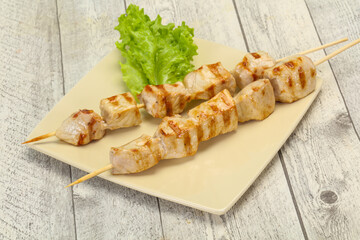 Grilled pork skewer served salad
