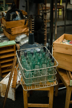 Vintage zero waste glass bottles in metal box on the street market