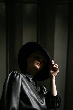 fashion shot of a girl in a wide-brimmed hat