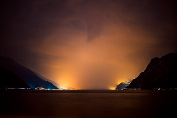 A noctural view over the illuminated lake garda