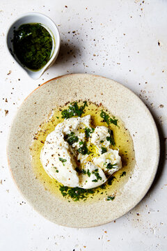 Fresh burrata with herb oil and toasted sourdough bread