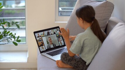 Little Girl Using Digital Laptop E-learning Concept. little girl children using laptop computer, studying through online e-learning system.