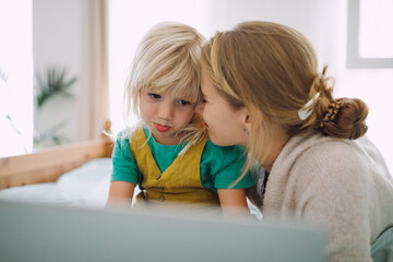 Mother and daughter with a laptop