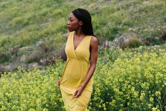 Black woman in yellow