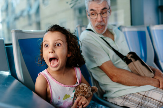 Naklejki Grandfather and granddaughter on the bus