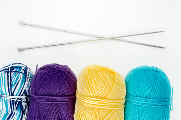 Close up shot of colored wool yarn balls as background