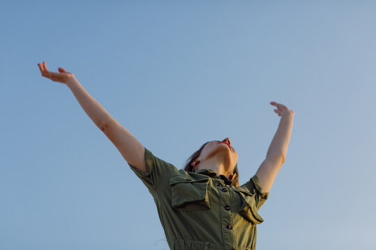 Woman over the blue sky