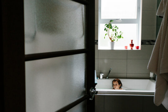 Kid having a bath.