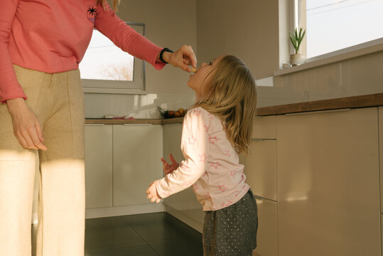 Mother and daughter on the kitchen