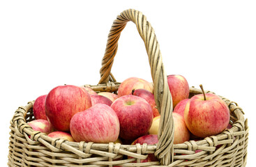 basket of willow twigs with ripe red apples