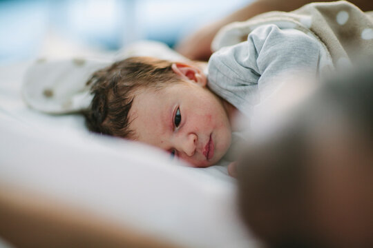 Father looking at baby born