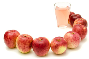 ripe apples and fresh juice in a glass