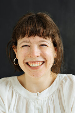 close up of a laughing charming brunette