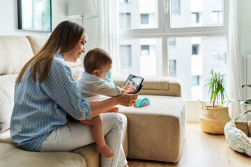 Mother with baby making video call to father