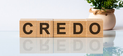 Word credo. Wooden small cubes with letters isolated on white background with copy space available