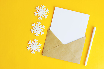 The letter and the snowflake on a yellow background.