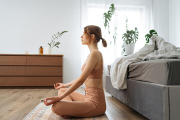 side view of a methidating girl in the bedroom