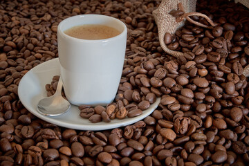 cup of coffee with coffee beans