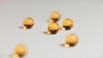 Orange capsules of fish oil balls