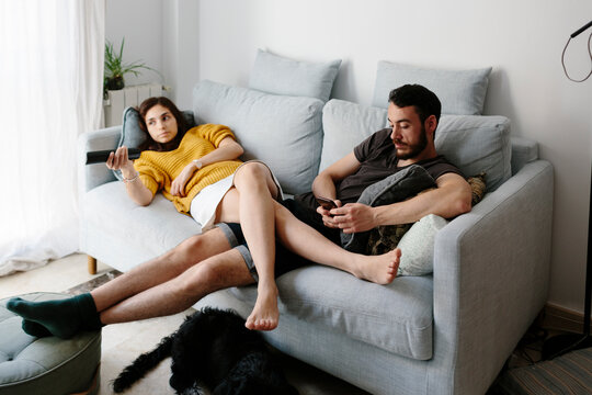 Young couple relaxing on sofa