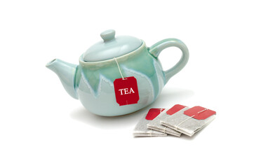 teapot, tea bags isolated on white background