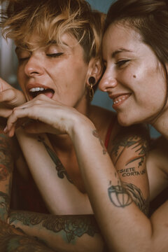 A lovely couple playing and kissing with complicity and intimacy in a show of their Love
