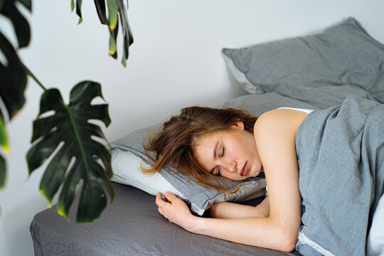 girl sleeping at home on the bed